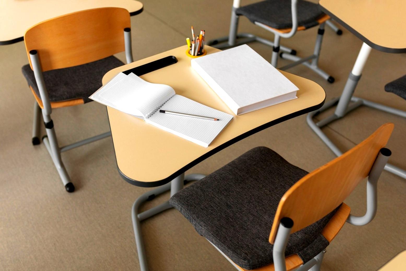 Person reviewing weekly budget planning materials