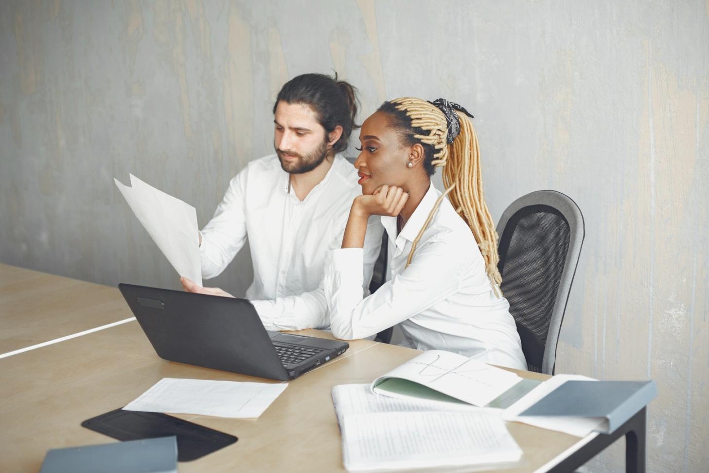 Person reviewing budget plans on laptop